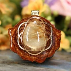 TEP Glowing Rutilated Quartz With Gold Seed Of Life
