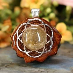TEP Pendants Glowing Rutilated Quartz With Silver Seed Of Life