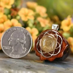 TEP Pendants Glowing Rutilated Quartz With Silver Seed Of Life